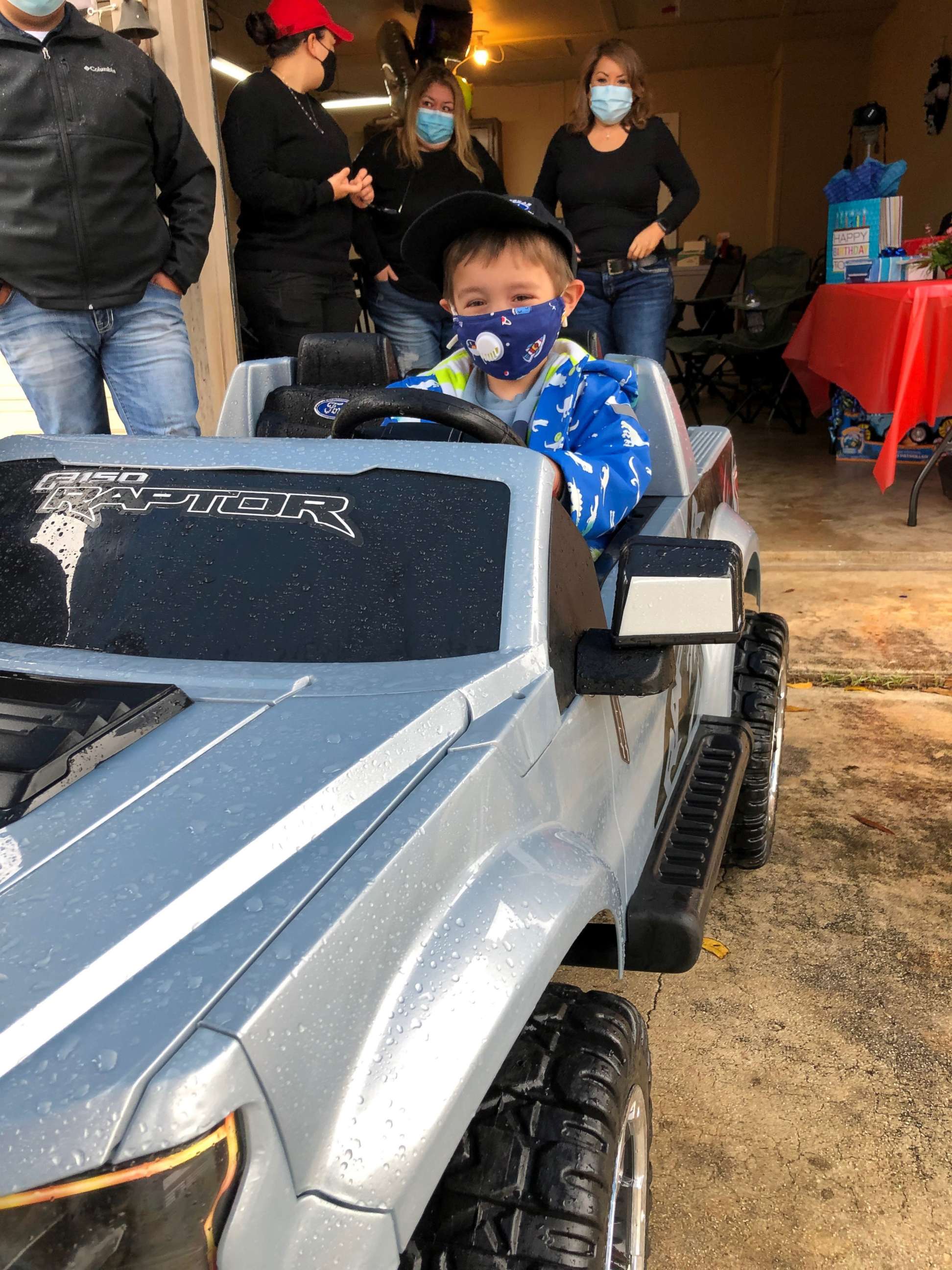 PHOTO: Raiden Gonzalez, of San Antonio, Texas, drives a toy car at his fifth birthday parade.