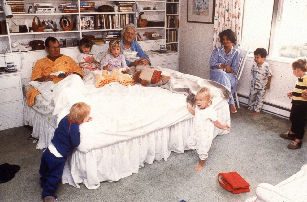 PHOTO: Vice president George H.W. Bush and his wife Barbara relax in bed as their daughter and grandchildren join them at home in Kennebunkport, Maine, 1987.