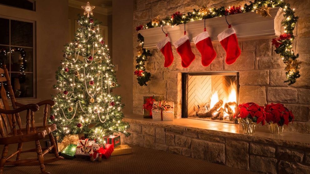 PHOTO: A Christmas tree and stockings hang from the mantel of a fireplace are pictured in this undated stock photo.