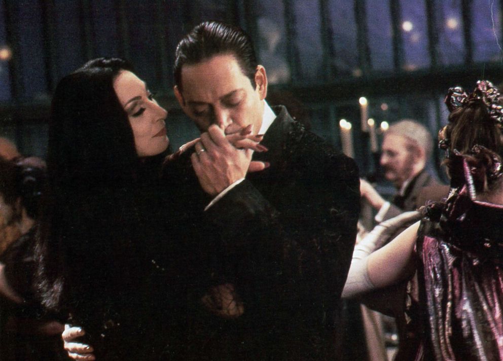 PHOTO: Anjelica Huston is kissed by Raul Julia in a scene from the film "The Addams Family."