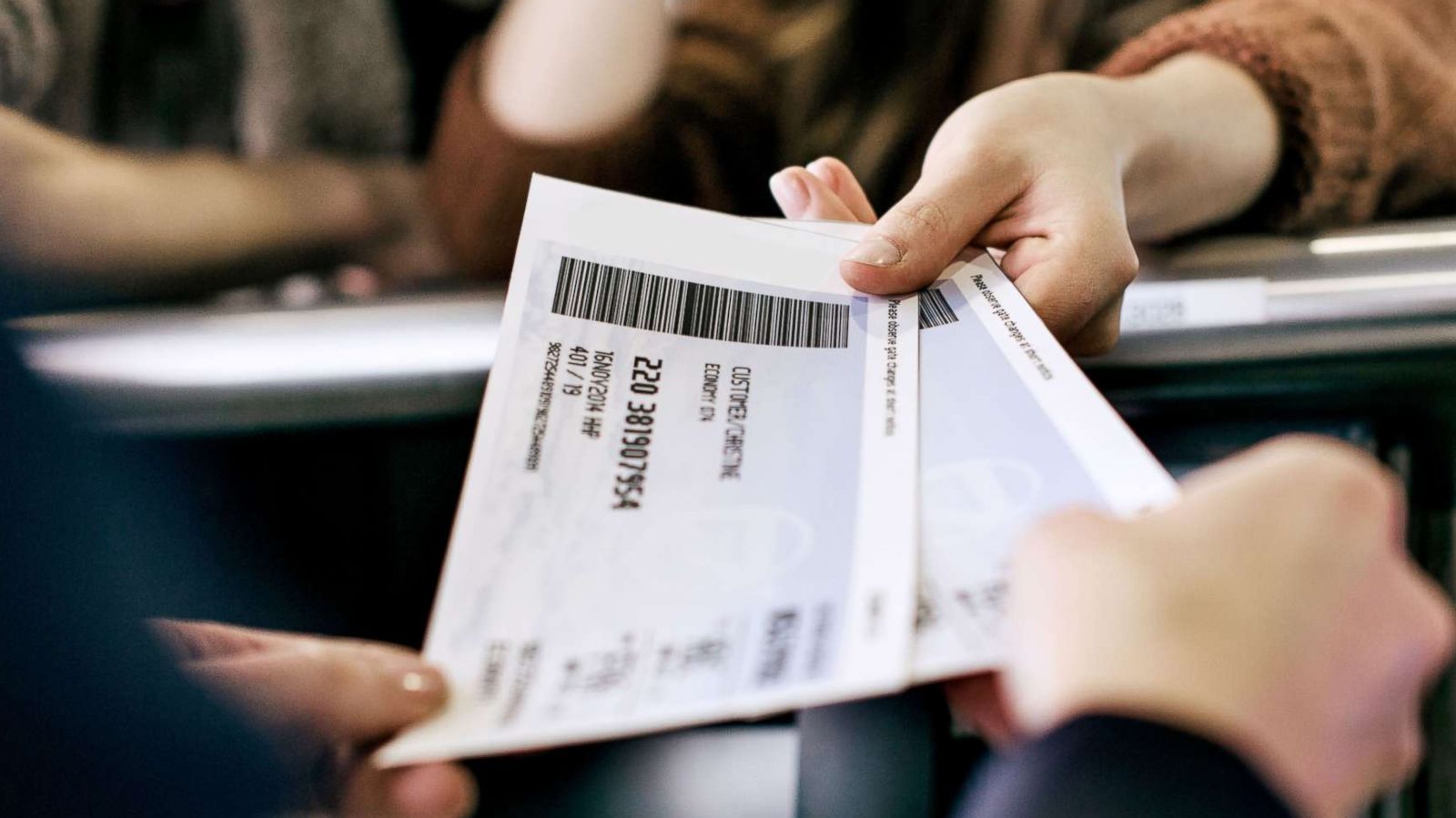 PHOTO: Travelers getting their boarding passes at an airline check-in counter in this undated stock photo.