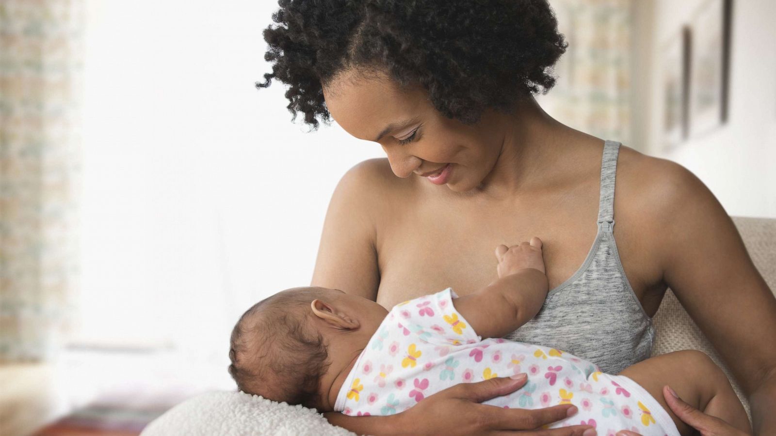 PHOTO: A mother breastfeeds a baby.