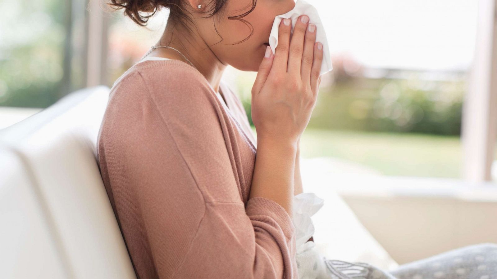 PHOTO:A woman blows her nose in this undated stock photo.