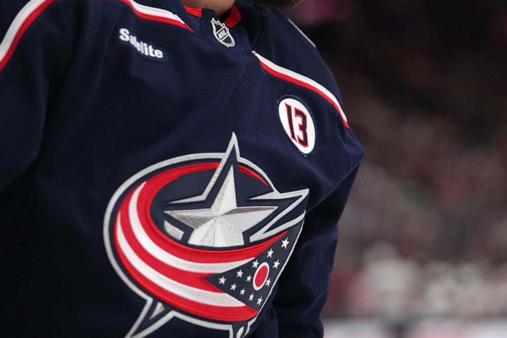 PHOTO: A #13 patch in remembrance of Columbus Blue Jackets player Johnny Gaudreau is shown during the home opener against the Florida Panthers at Nationwide Arena in Columbus, Ohio, Oct. 15, 2024.