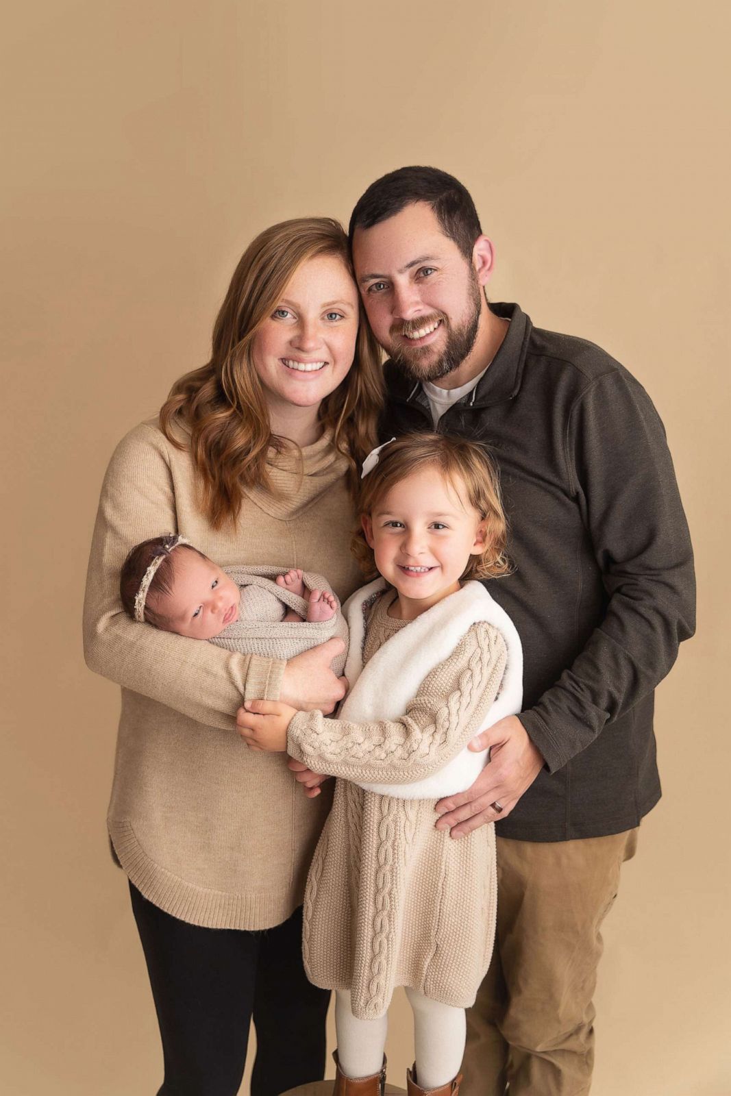 PHOTO: Tina (mom), Ben (dad), Emma (sister) and Molly Gibson pose for a photo.