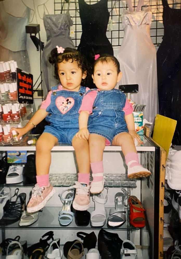 PHOTO: Sisters Gipsy and Gelssy Rodriguez sit on the counter of their parents boutique, Moda2000, as toddlers.