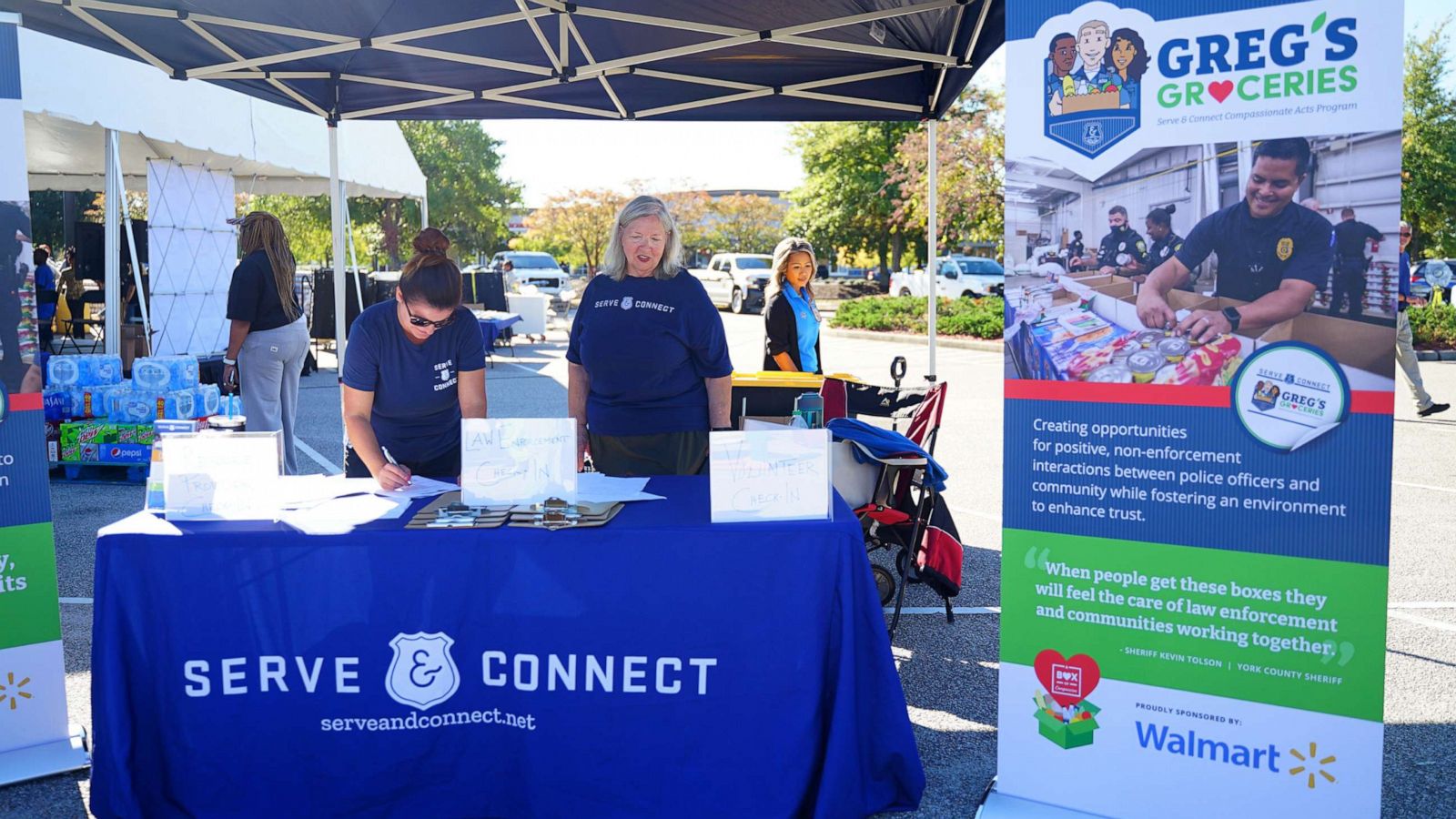 PHOTO: Volunteers stand at Serve & Connect information booth on Oct.5, 2022.