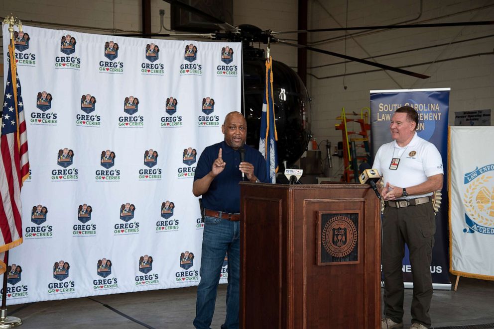 PHOTO: Pastor T.A. Belton speaks during a Greg's Groceries event.