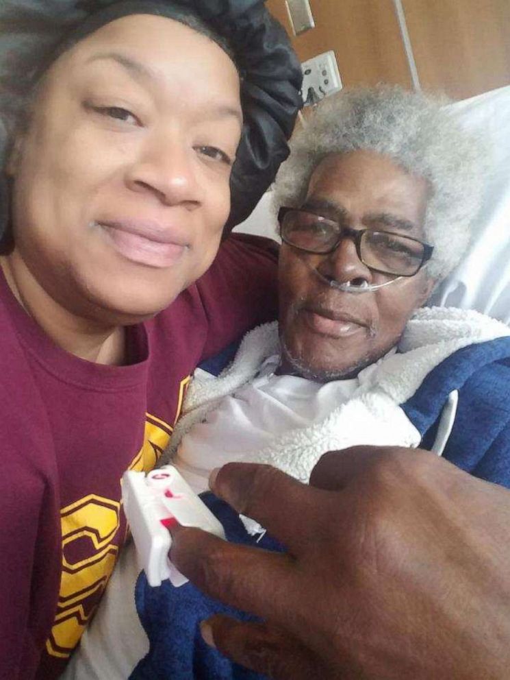 PHOTO: Keasha Hawkins in the hospital with her father on September 35, 2018, the day before her cancerous mass was surgically removed.
