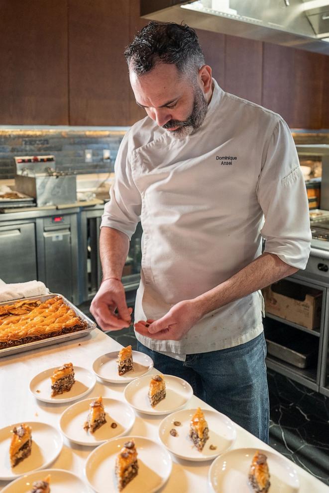 PHOTO: Chef Dominique Ansel puts the final Honey Bunches of Oats Chocolate pieces atop his chocolate baklava.