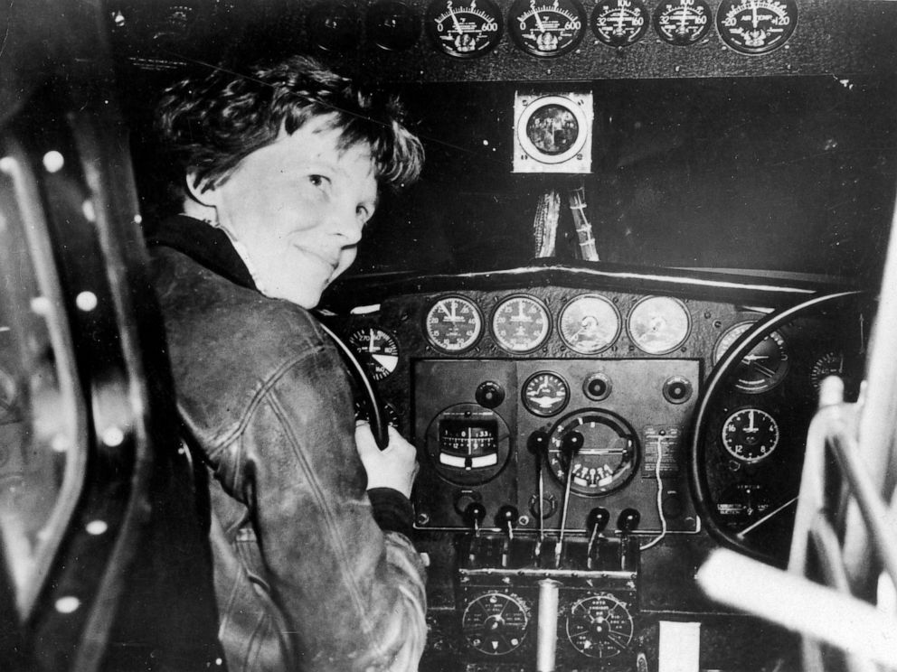PHOTO: Amelia Earhart in the cockpit of a plane. 
