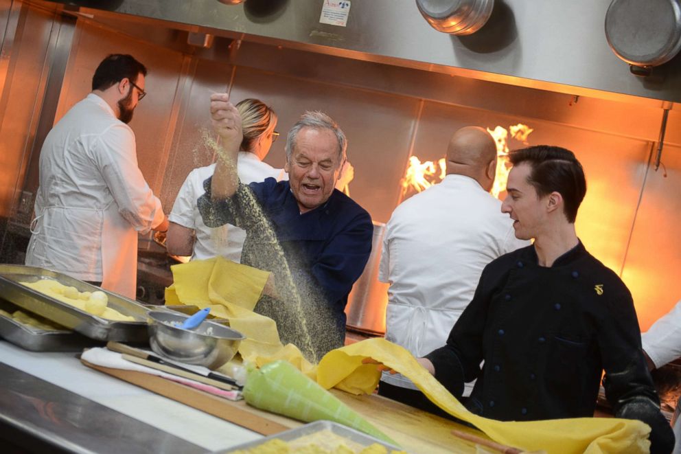 PHOTO: Chef Wolfgang Puck prepares food for the Oscars after-party in the kitchen ahead of the Governors Ball.