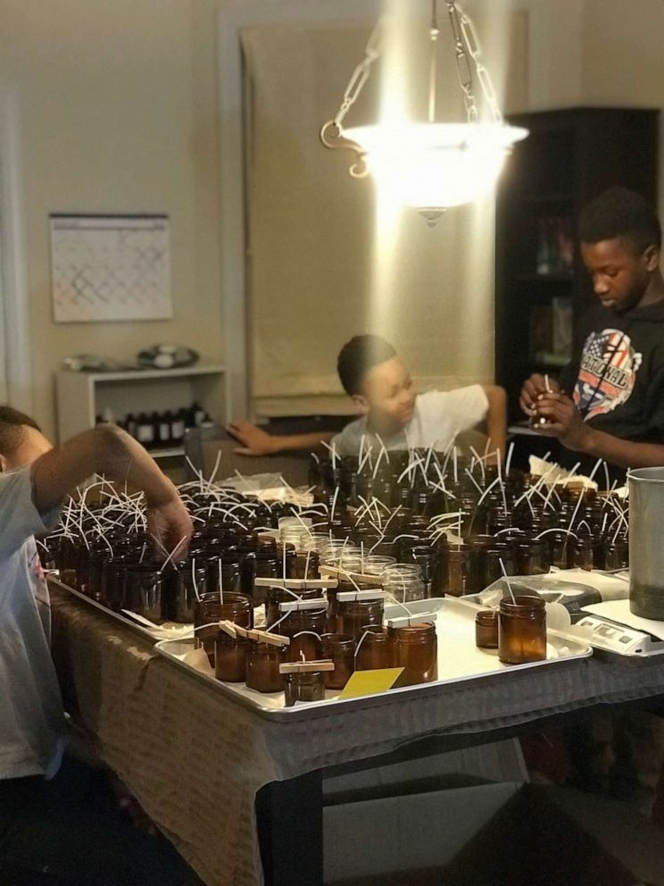 PHOTO: The Gill brothers prepare candles to make for their business Frères Branchiaux.