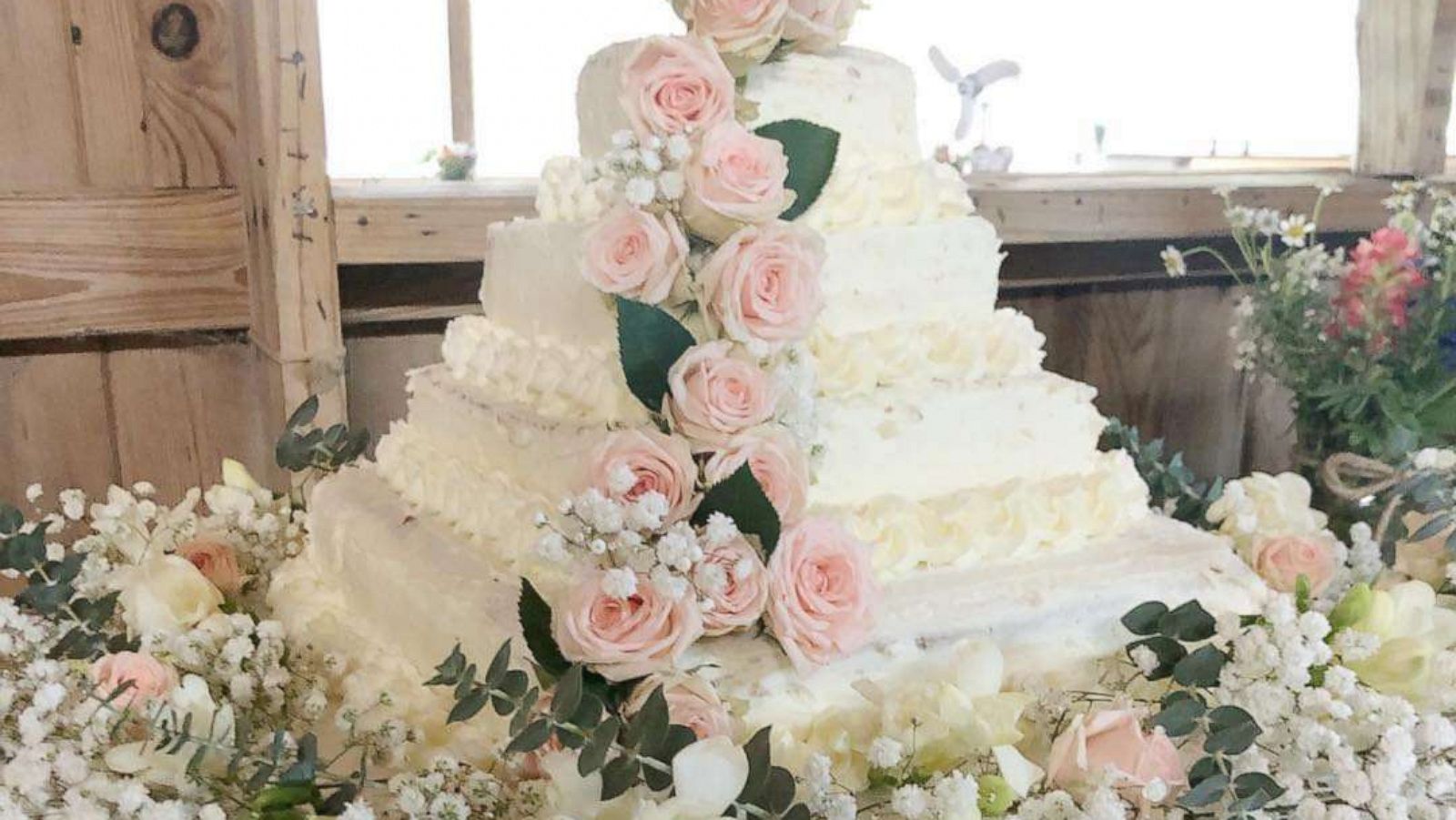 PHOTO: A wedding cake made from white sheet cakes from Costco and fresh flowers from Trader Joe's.