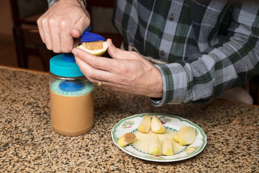 PHOTO: The Peanut Butter Pump dispenses perfect ribbons of peanut butter onto apple slices.