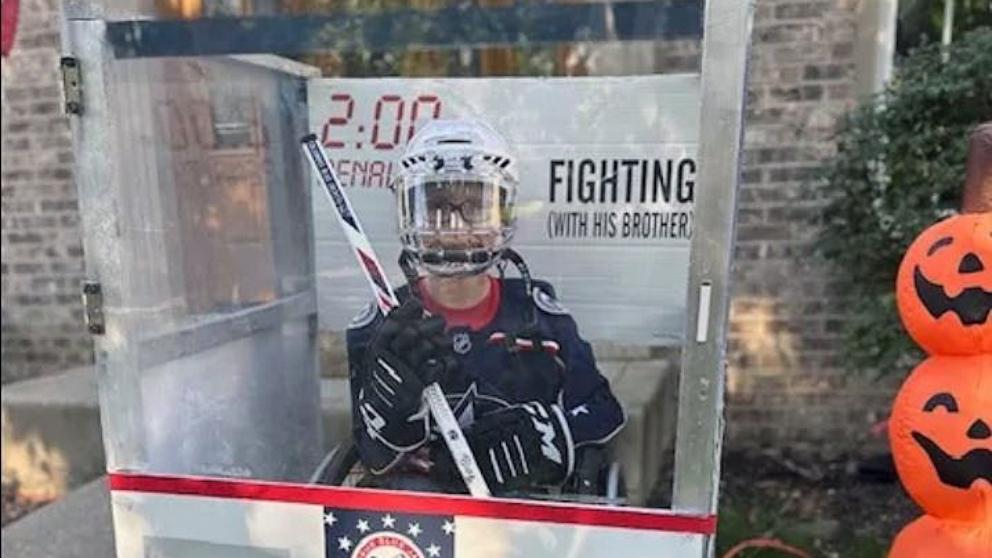 PHOTO: Blake, 11, who was born with spina bifida, built his Halloween costume, a hockey penalty box, around his wheelchair.