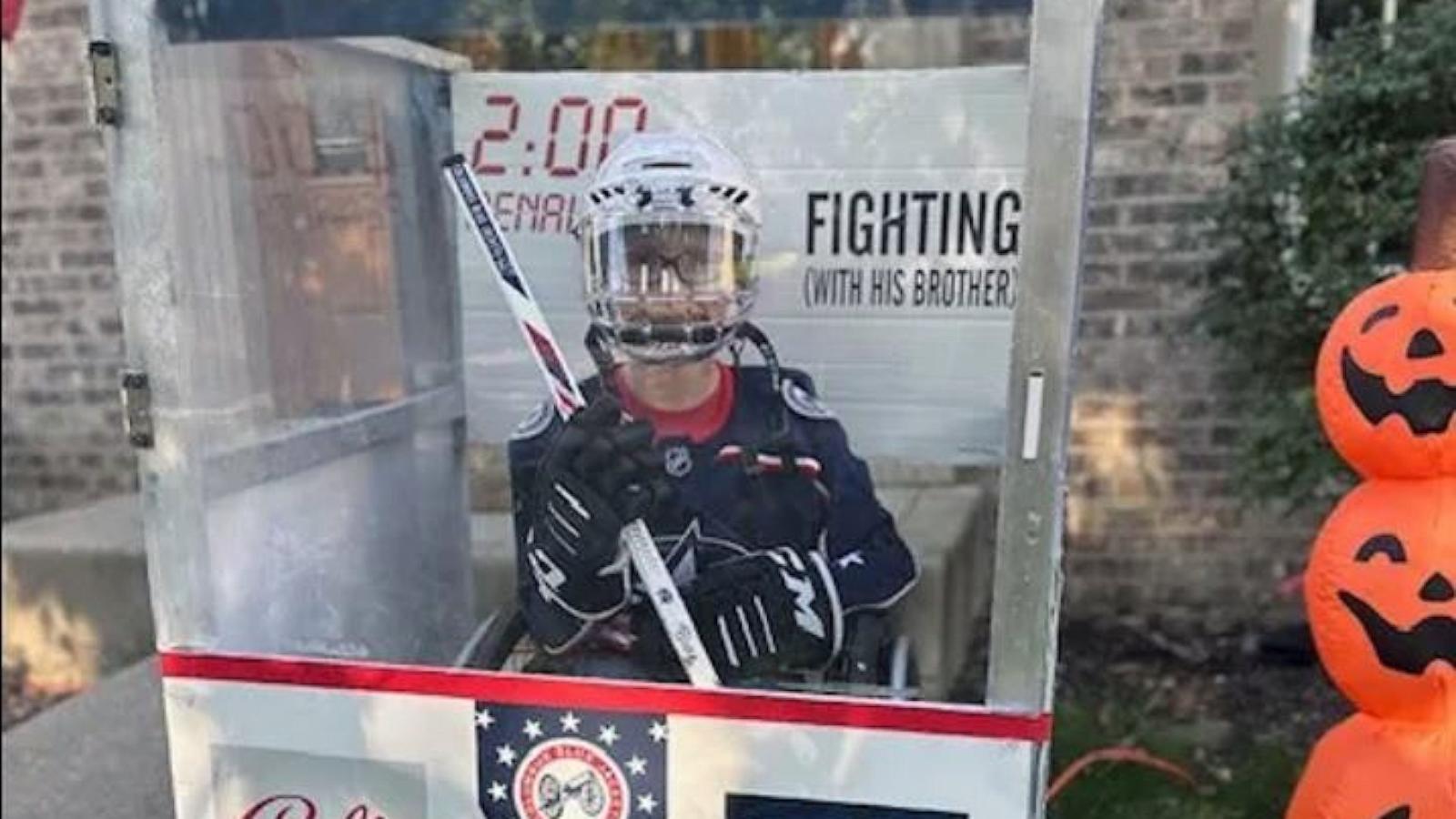 PHOTO: Blake, 11, who was born with spina bifida, built his Halloween costume, a hockey penalty box, around his wheelchair.