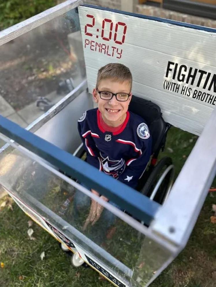 PHOTO: Blake, 11, who was born with spina bifida, built his Halloween costume, a hockey penalty box, around his wheelchair.