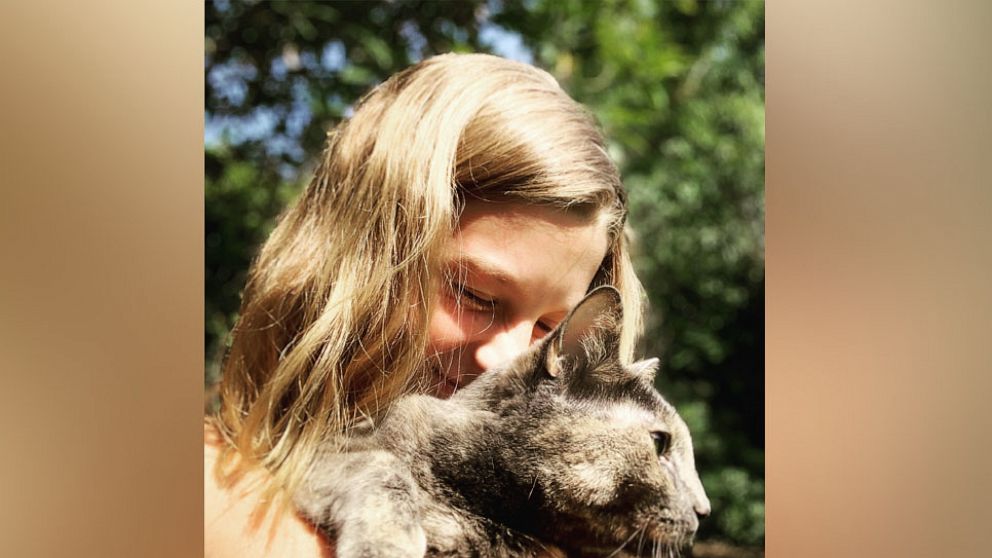 PHOTO: Hannah, 14, of San Diego, poses with her pet cat in a photo provided by her mom.