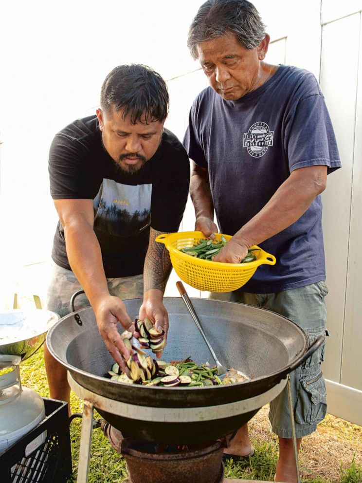 PHOTO: Chef Sheldon Simeon and his dad cooking together as seen in his new cookbook, "Eat Real Hawaii."
