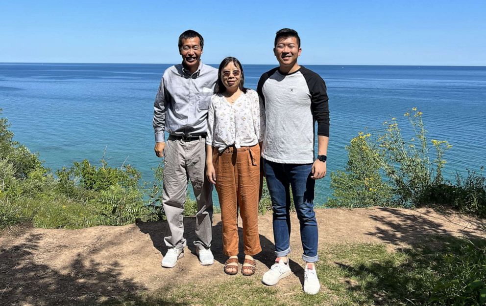 PHOTO: Hefei Liu (far right) smiles for a photo with his parents, dad Lewis Liu and mom Wenjing Cao.