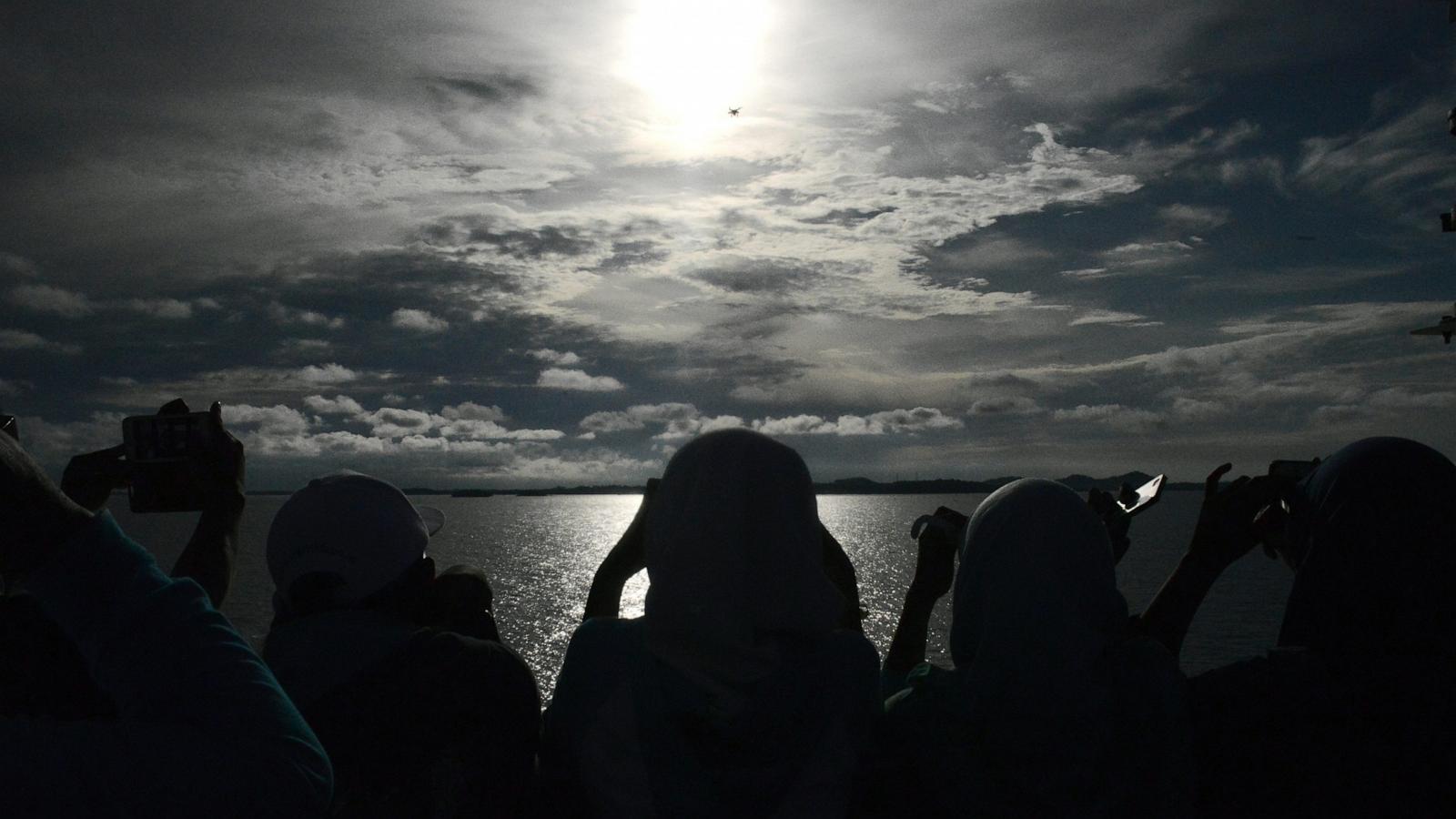 PHOTO: Passengers gather to watch the total solar eclipse onboard the Indonesian cruise ship KM Kelud near the island of Belitung in Indonesia, March 9, 2016.