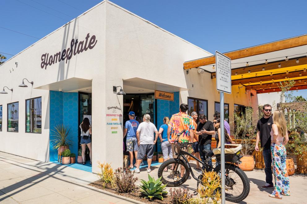 PHOTO: Customers line up to eat at HomeState in Oceanside, California.