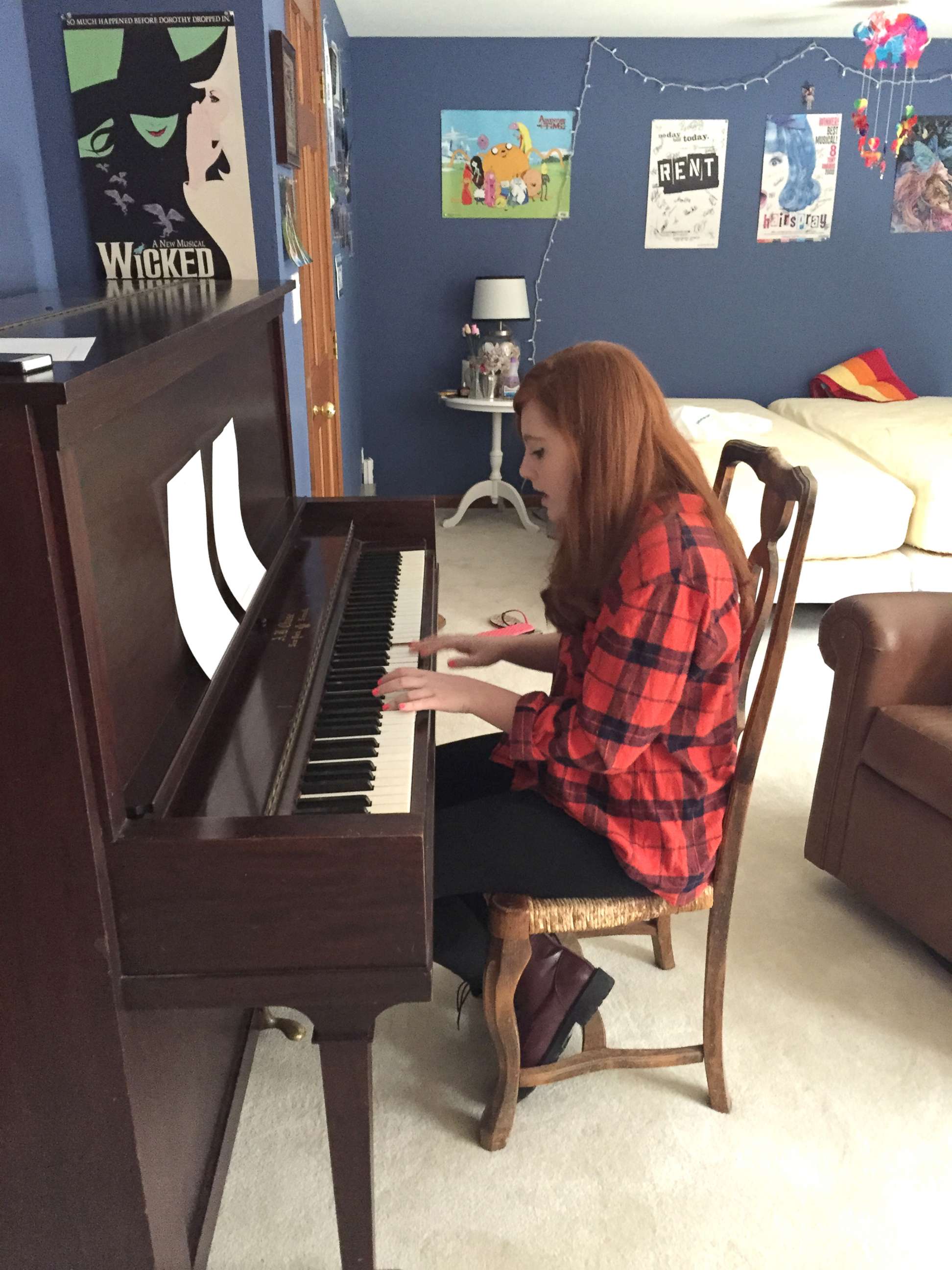 PHOTO: Liv Beuf is photographed playing piano, which her family says was one of her passions.