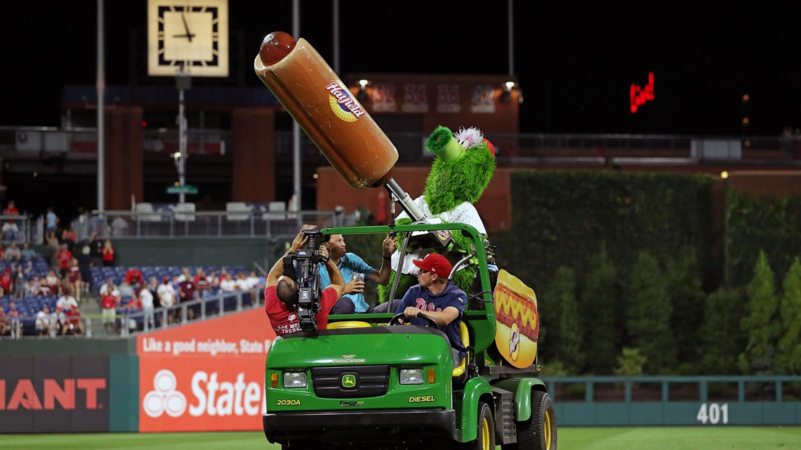 PHOTO: The Phillie Phanatic shoots Hatfield hot dogs into the crowd during a game at Citizens Bank Park Philadelphia, PA, Sep. 15, 2021.