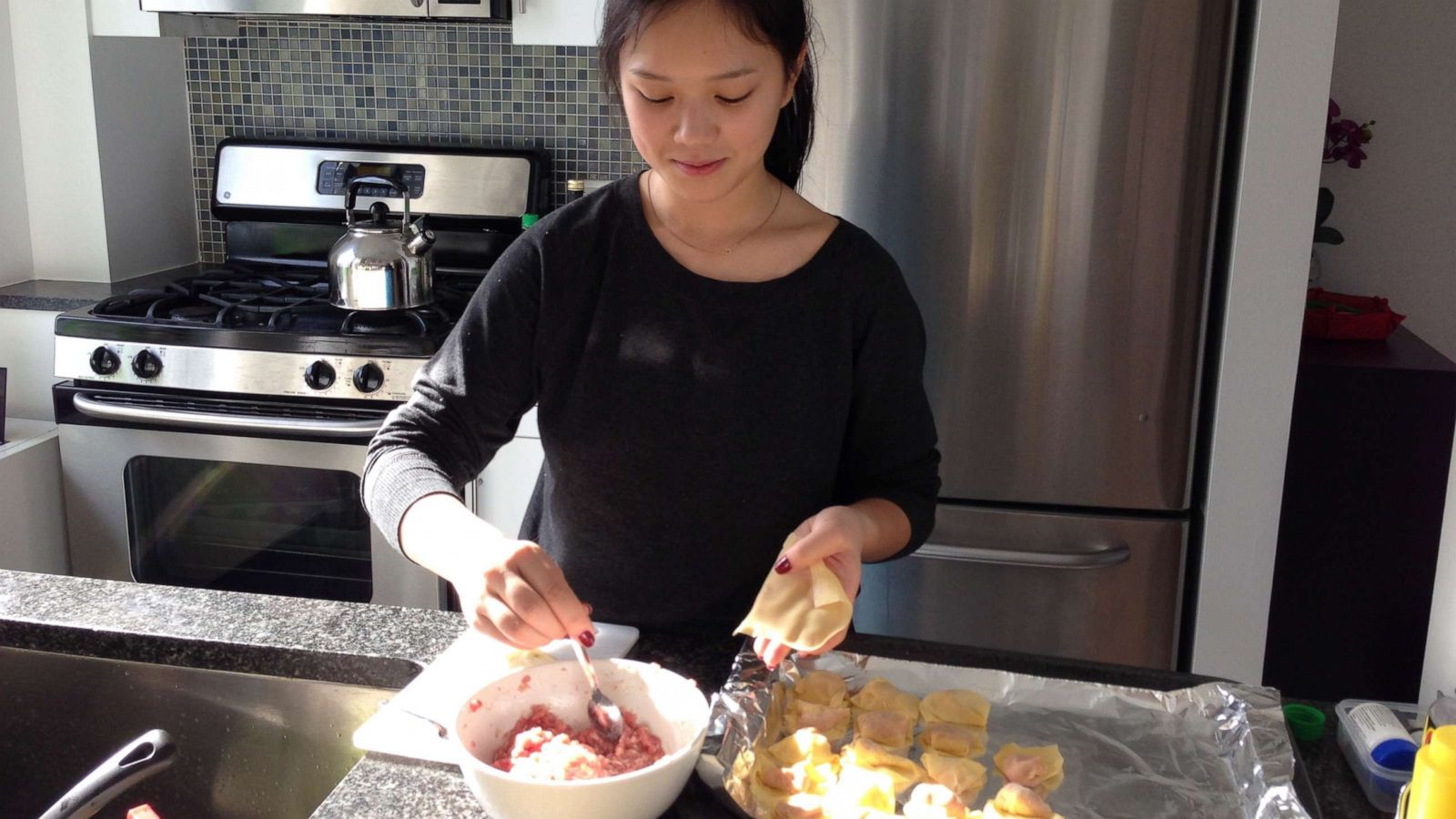 PHOTO: Umamicart co-founder Andrea Xu makes homemade dumplings in her kitchen.