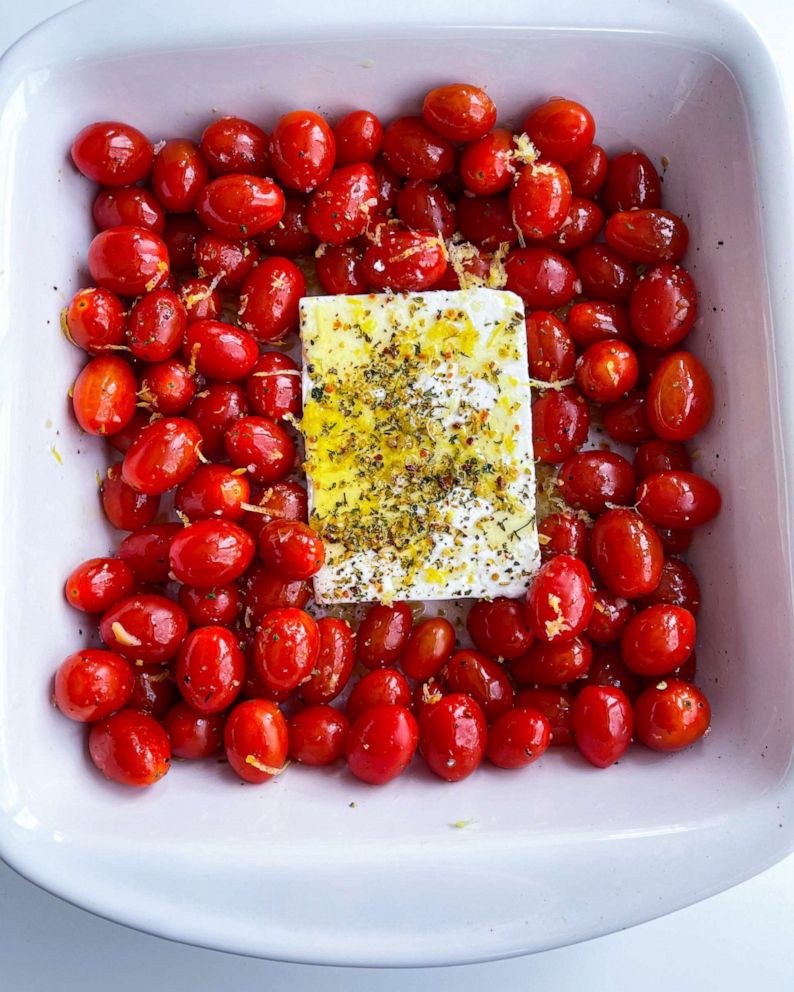 PHOTO: Tomatoes, feta cheese, herbs, olive oil and lemon zest ready to be roasted in the oven.