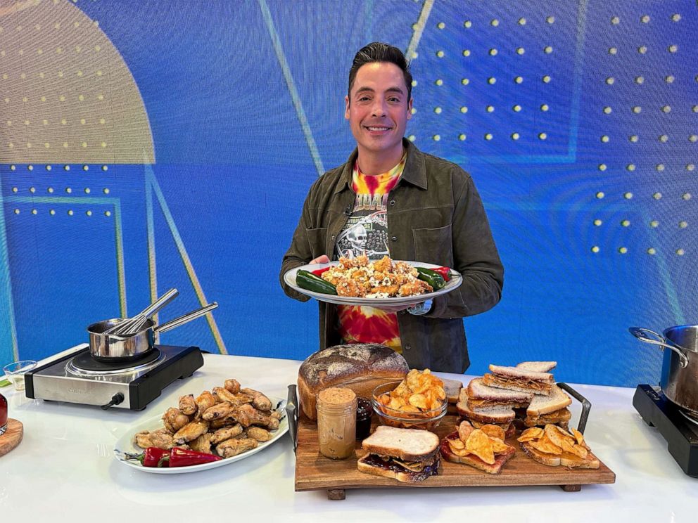 PHOTO: Jeff Mauro with a plate of popcorn shrimp and other "chaos cooking" dishes.