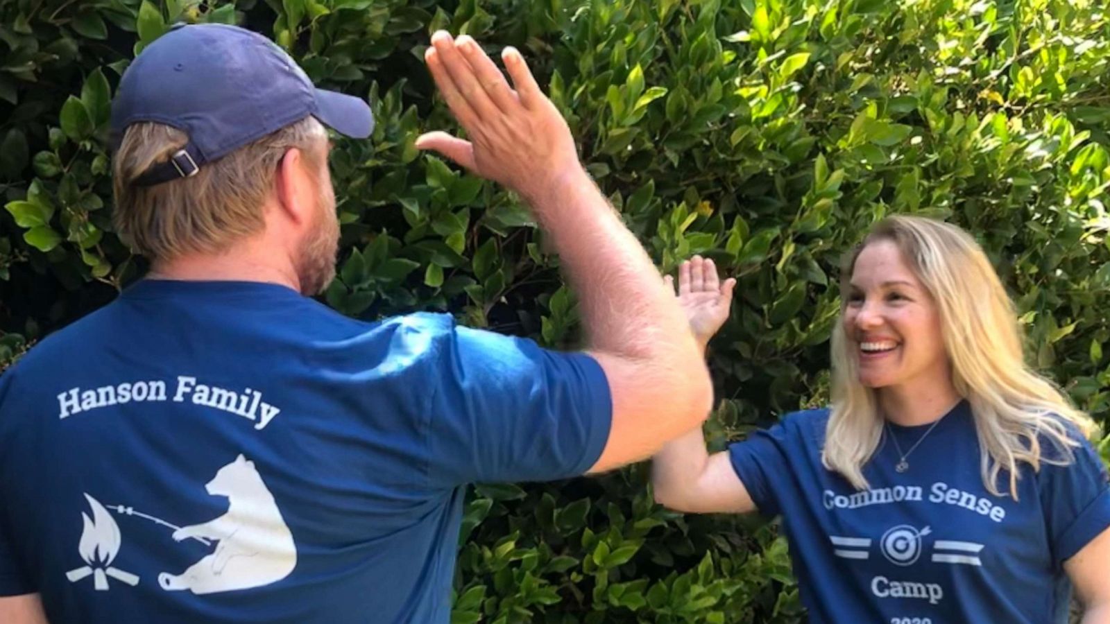 PHOTO: Oona Hanson and her husband give each other a high-five.