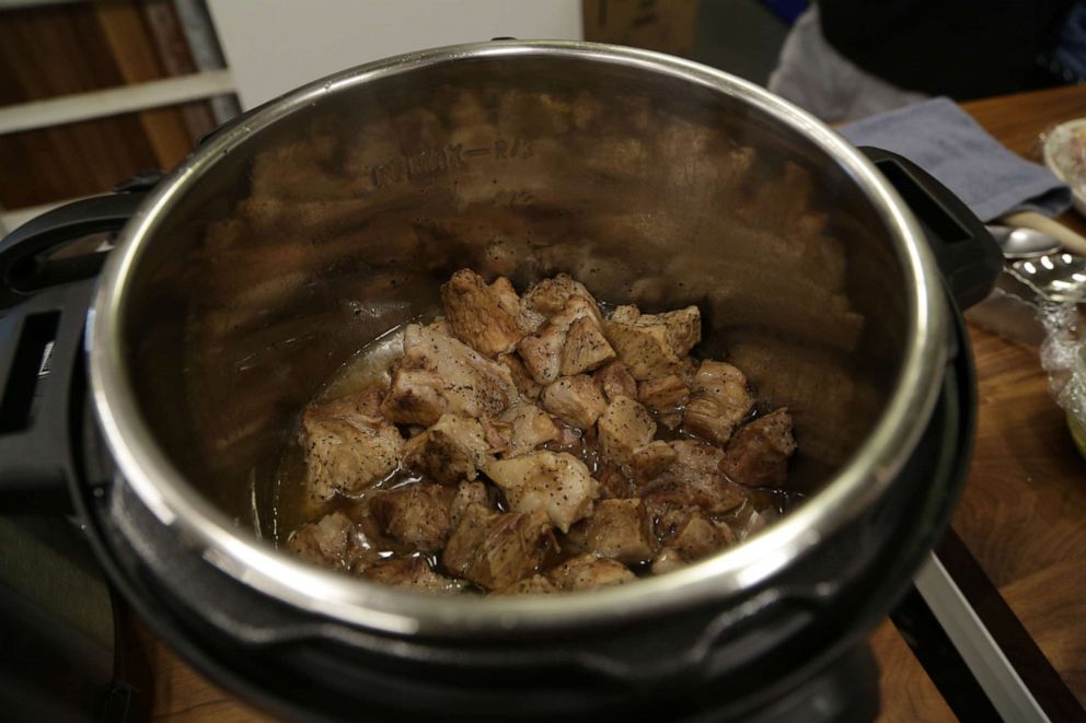 PHOTO: Pork cooking in an Instant Pot to make Bo Ssäm-style pulled pork sandwiches.