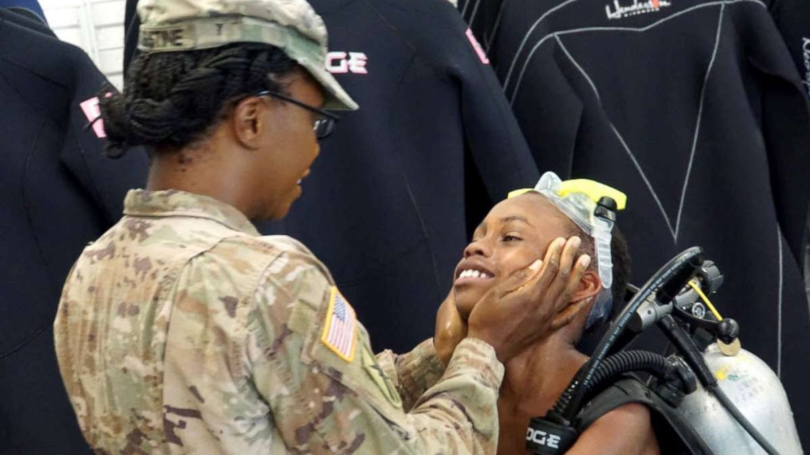 PHOTO: Vaneshyia Augustine, who has been deployed in Afghanistan for nine months, surprised her 10-year-old son, Jamari Davis, during his scuba diving class in Atlanta in July.