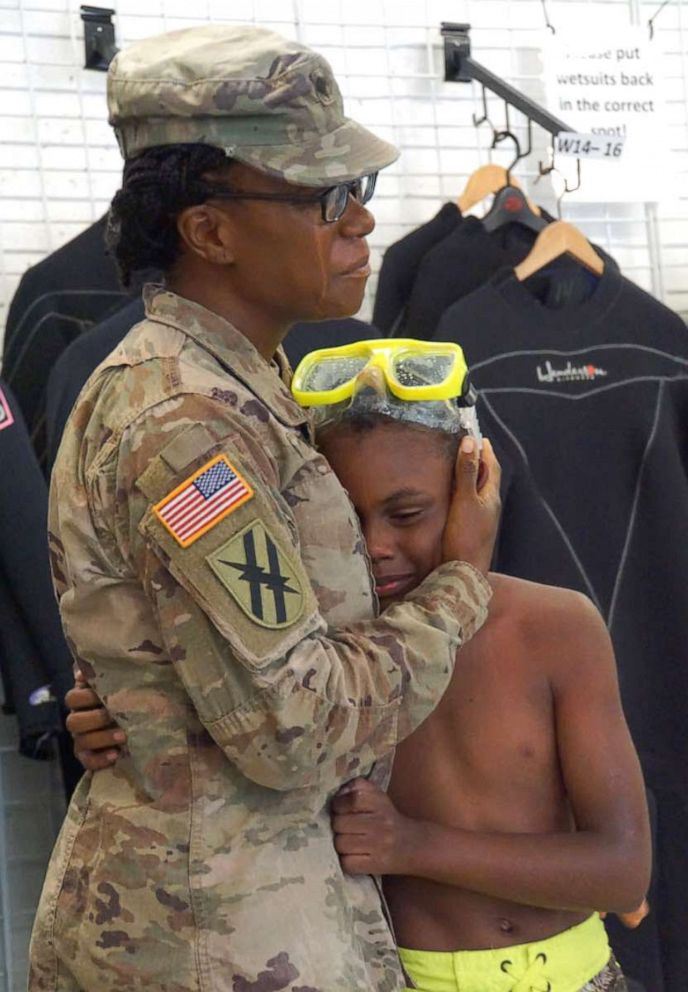 PHOTO: Vaneshyia Augustine, who has been deployed in Afghanistan for nine months, surprised her 10-year-old son, Jamari Davis, during his scuba diving class in Atlanta in July.