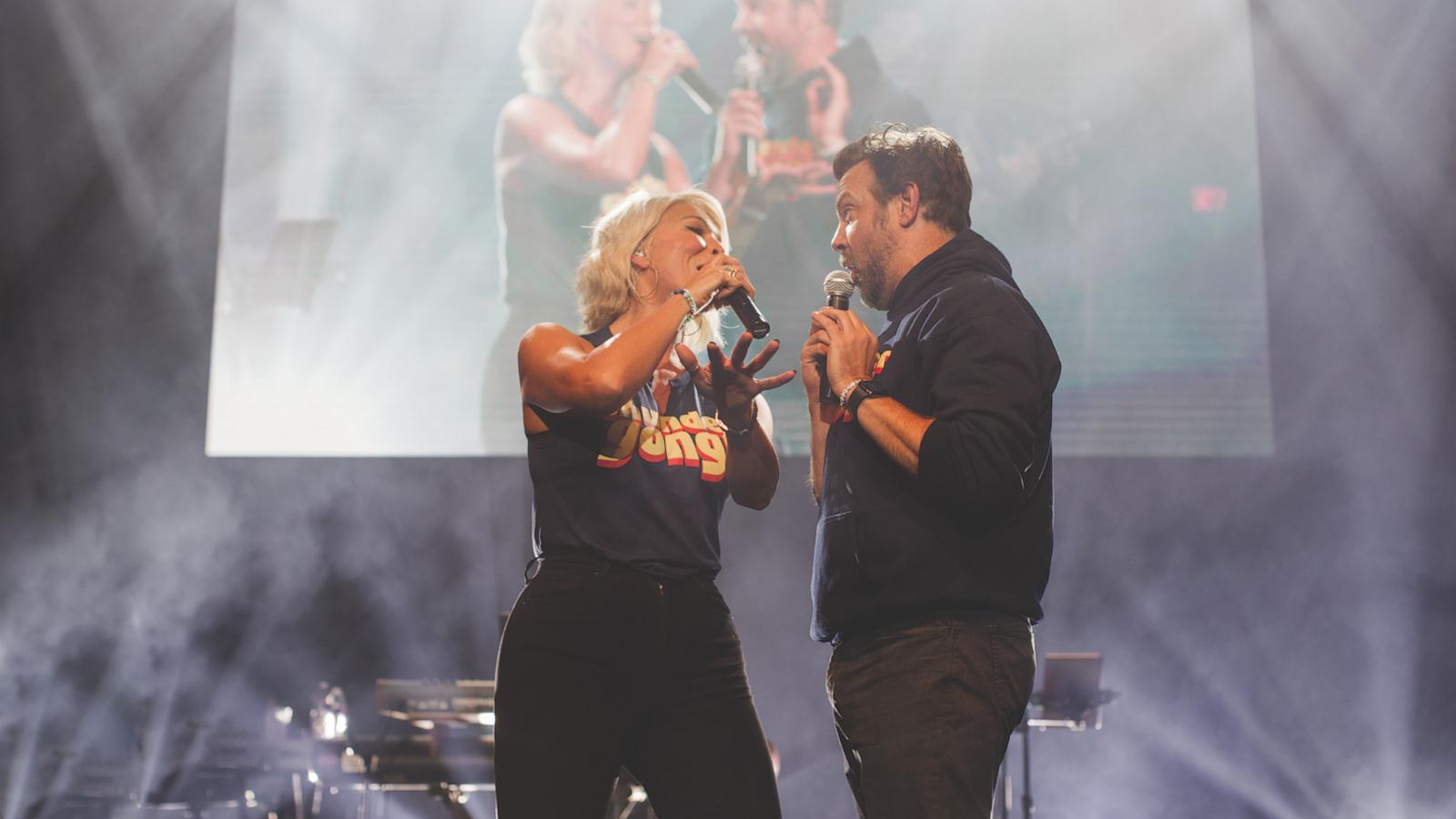 PHOTO: Jason Sudeikis and Hannah Waddingham perform onstage at the 7th annual THUNDERGONG charity concert at Uptown Theater in Kansas City.