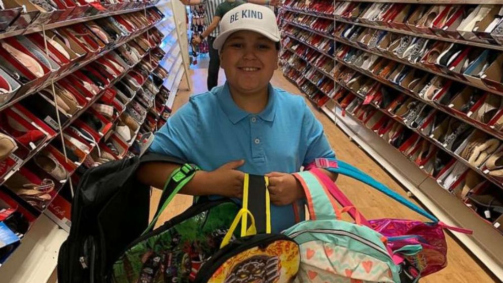 PHOTO: Jayden Perez shops for backpacks for kids in need.