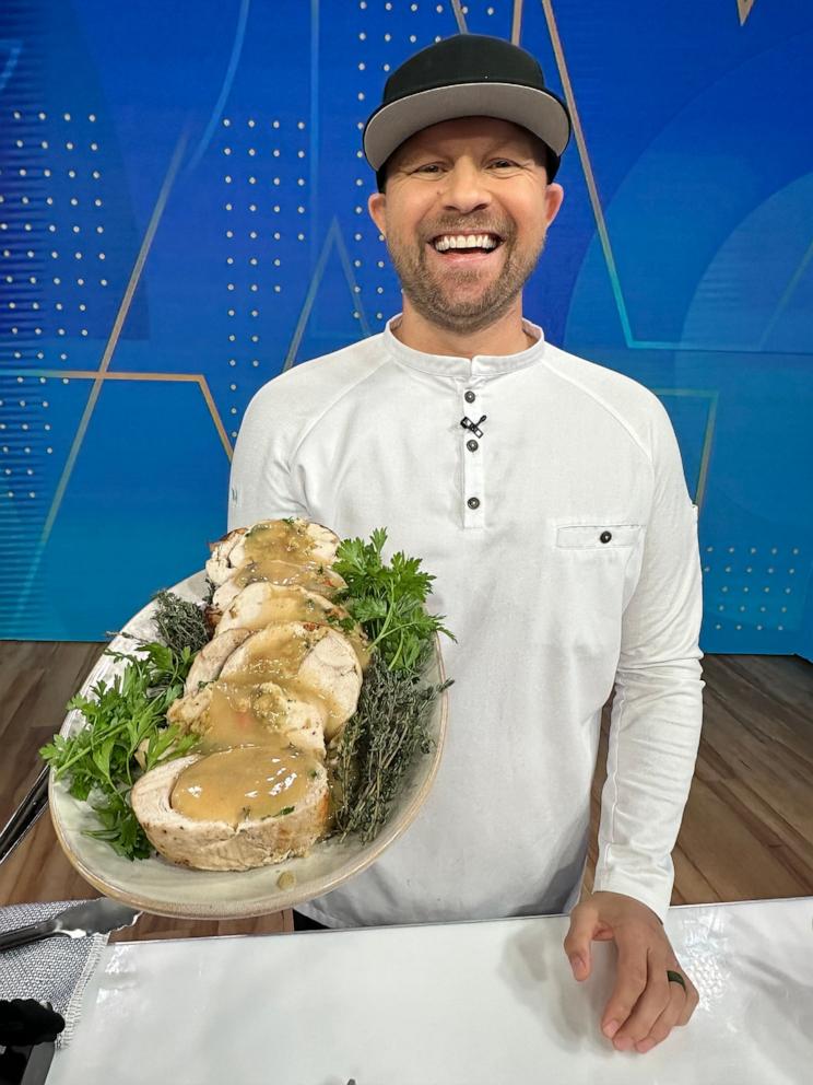 PHOTO: Chef Jeremy Ford holds a platter of stuffed turkey breast.