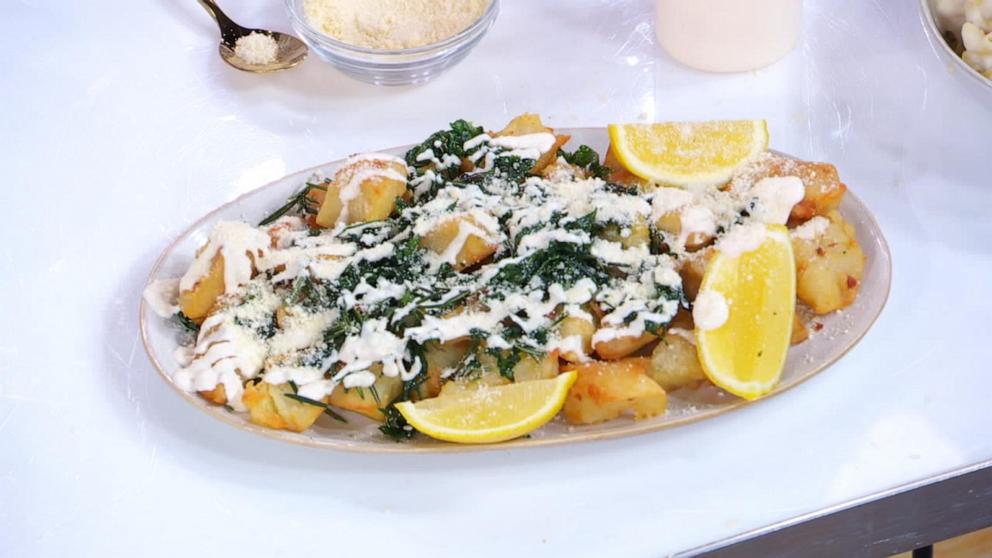 PHOTO: A plate of crispy potatoes with herbs and lemon aioli.