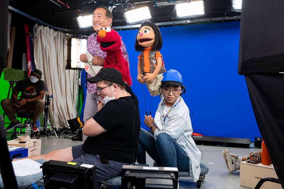 PHOTO: Muppet Ji-Young performed by Sesame Workshop puppeteer Kathleen Kim, right, at work on the set of the upcoming "Coming Together" special.