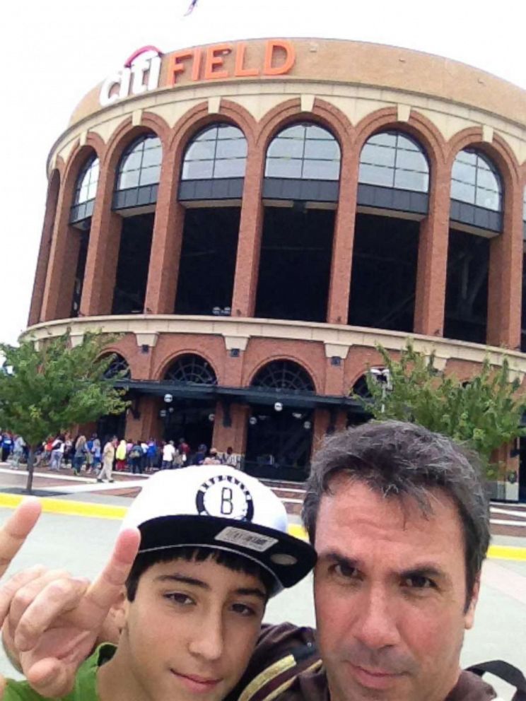PHOTO: Manny Oliver and his late son Joaquin Oliver pose outside of Citi Field on one of their annual baseball trips.