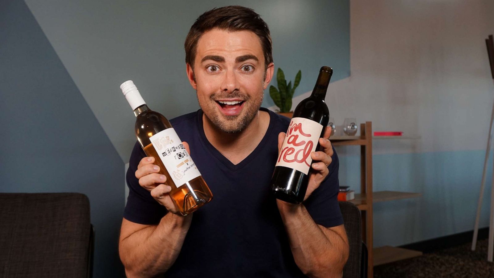 PHOTO: Jonathan Bennett with the two Nocking Point wines inspired by "Mean Girls."