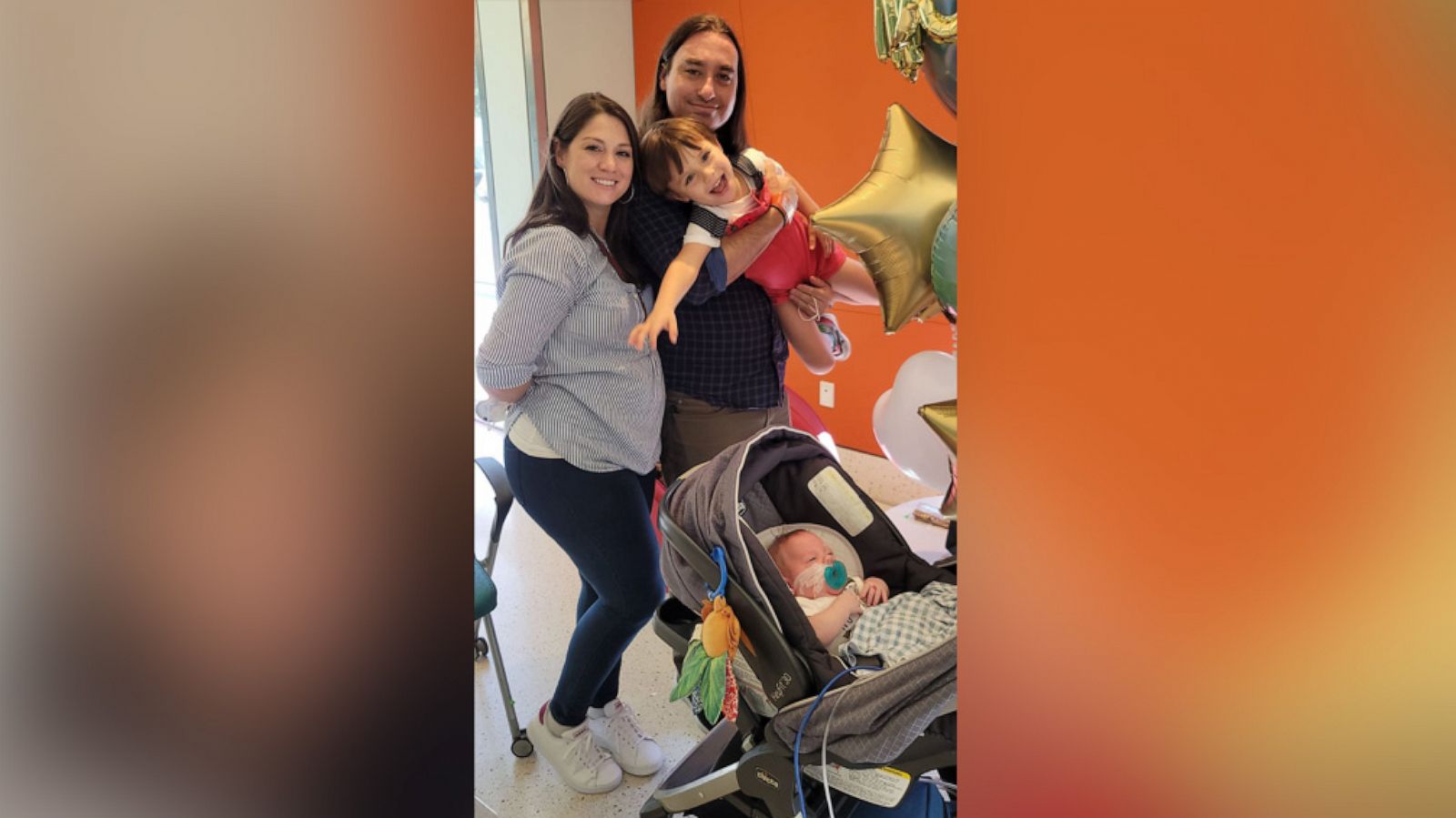 PHOTO: Valerie Kasper poses with her partner Steven and their two children on the day their youngest son, Theodore, went home from the NICU.