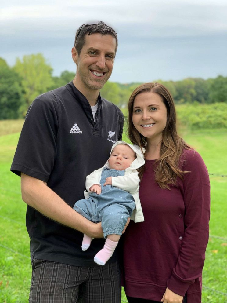 PHOTO: Katy and Zac Engler pose with their daughter Elise.