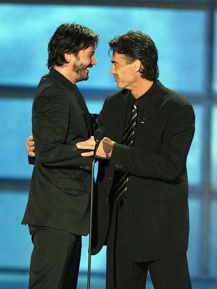 PHOTO: Keanu Reeves accepts the honorary award for "Action Movie Star" from stunt double Chad Stahelski at the 4th Annual Taurus World Stunt Awards at Paramount Pictures May 16, 2004 in Los Angeles.