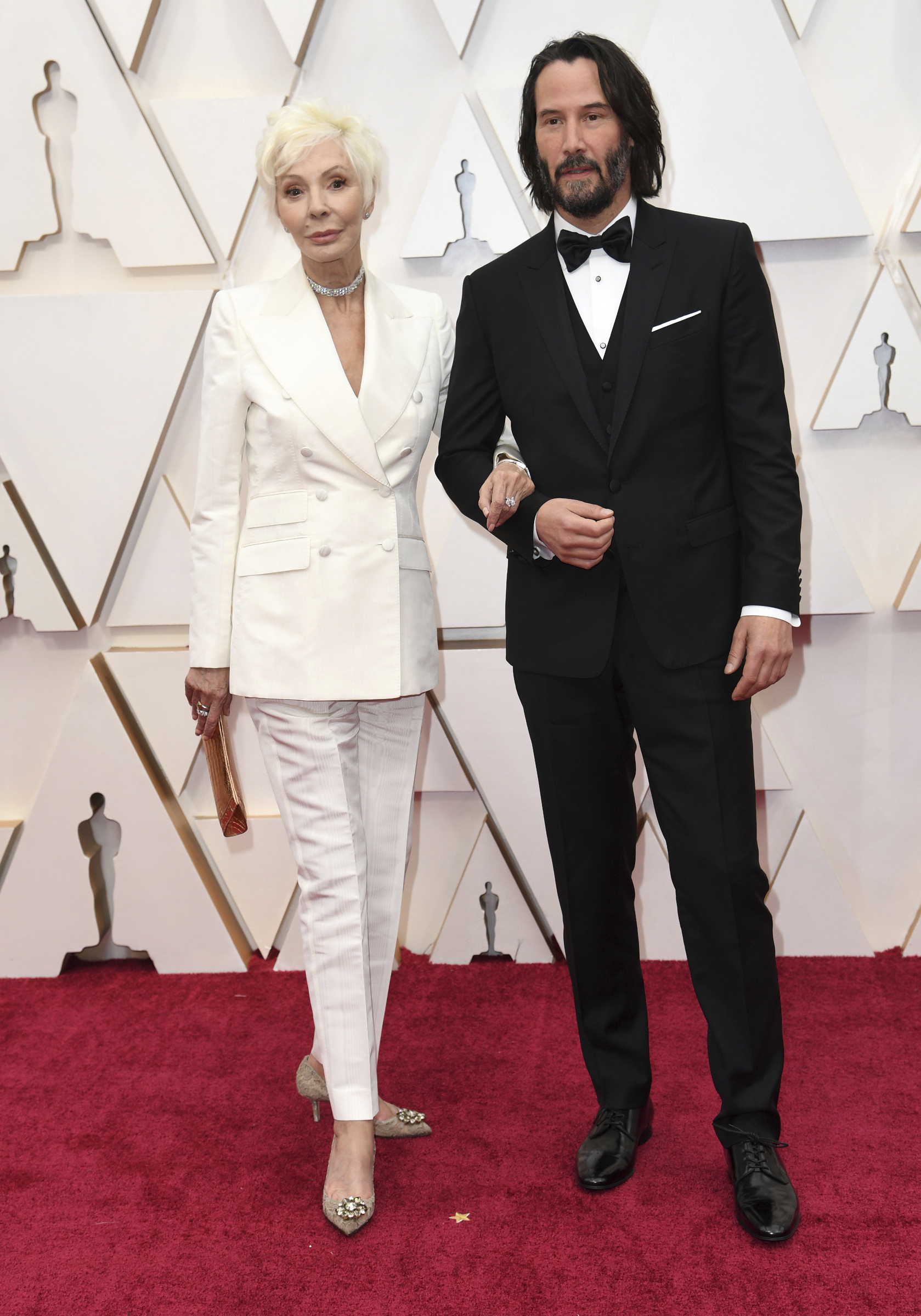 PHOTO: Patricia Taylor and Keanu Reeves arrive at the Oscars, Feb. 9, 2020, in Hollywood, Calif.