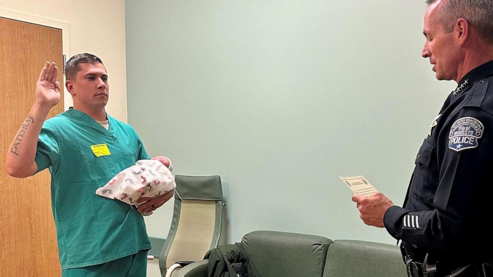 PHOTO: Trent Kersey was sworn in as a Modesto police officer on Oct. 31, 2023 while holding his newborn son Theo in his arm.