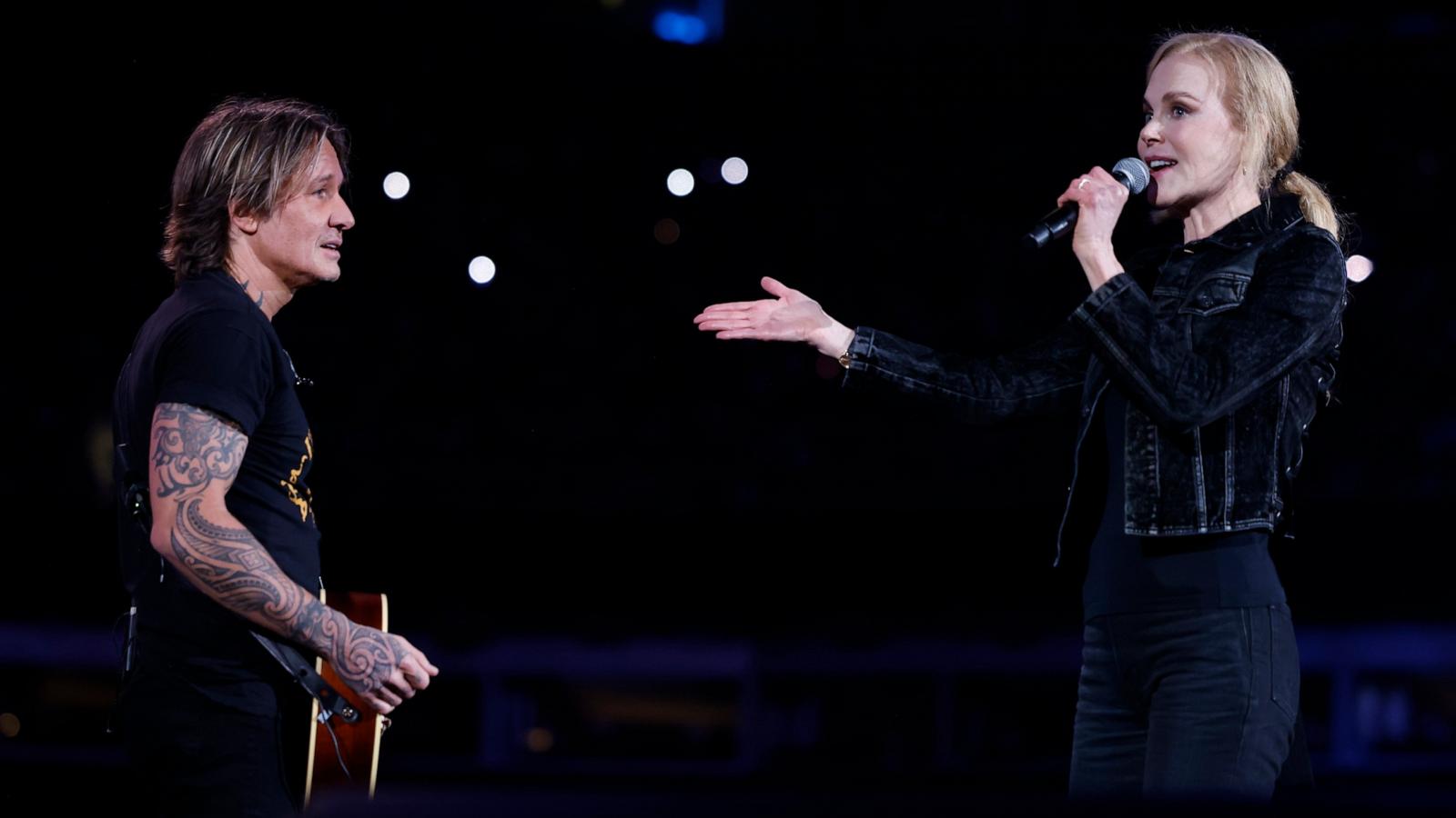 PHOTO: Keith Urban and Nicole Kidman speak onstage at the Concert For Carolina Benefit Concert at Bank of America Stadium in Charlotte, NC, Oct. 26, 2024.