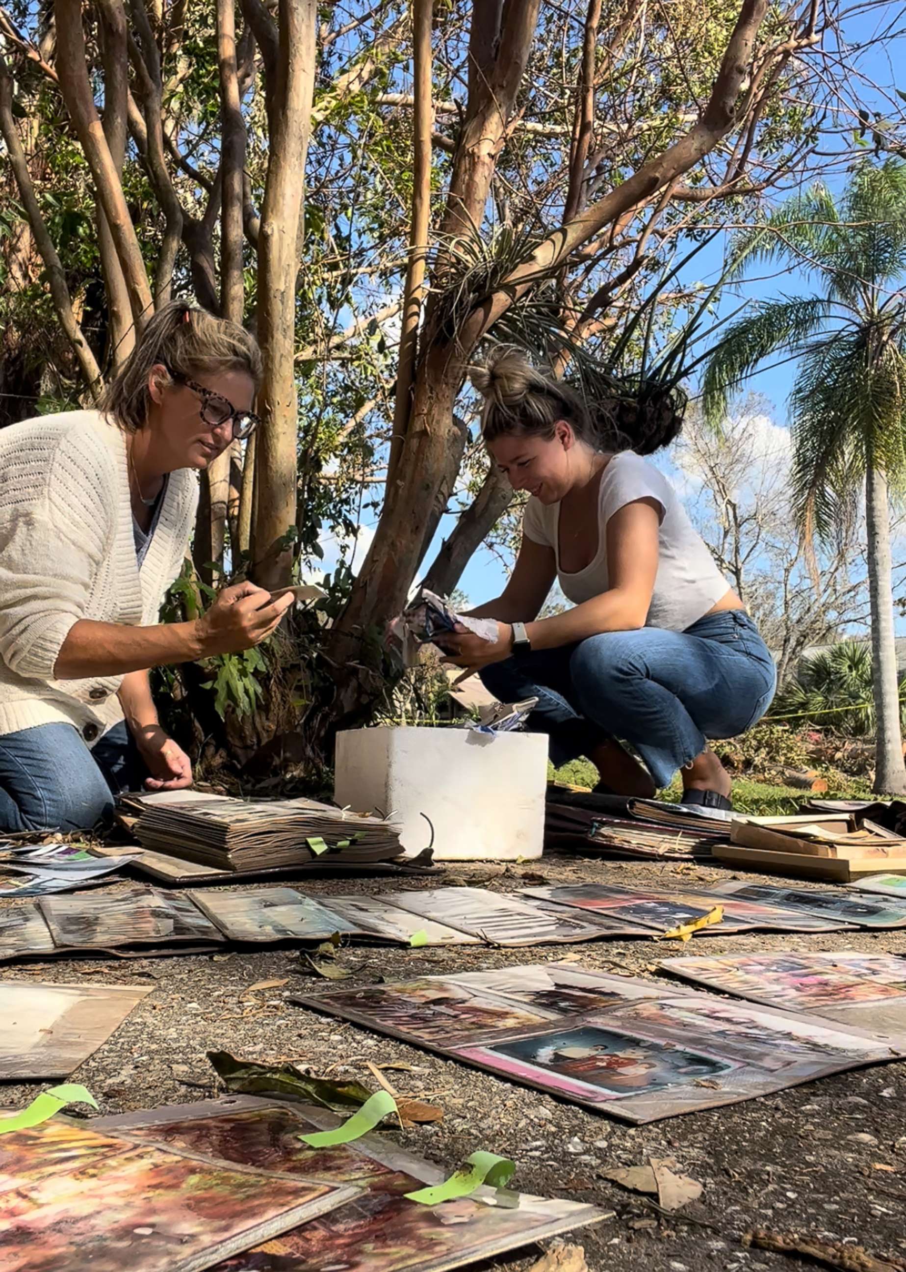 PHOTO: Krista Kowalczyk, owner of Impressions Photography, works with her assistant Maddie Briggs to recover photographs in Fort Myers, Florida, after Hurricane Ian.